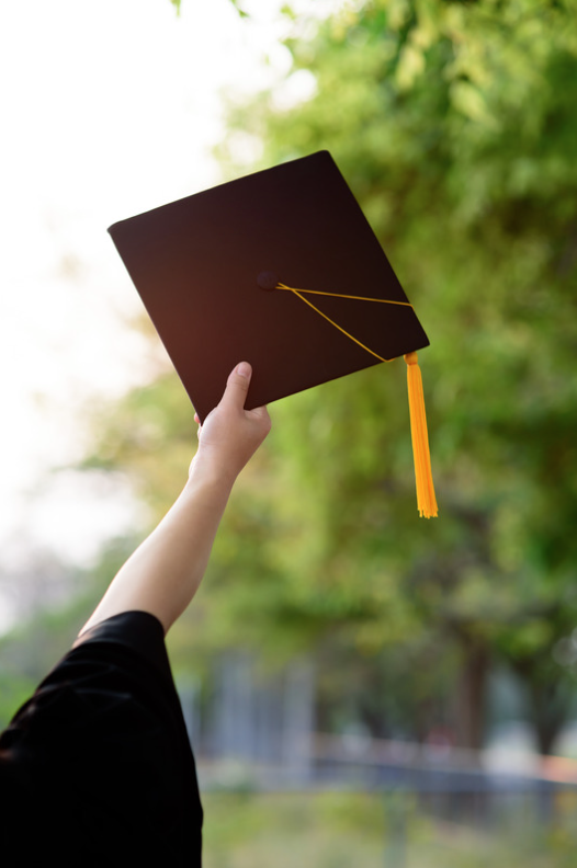 Picture of a successful graduate reflecting the positive sentiment students will feel when we help them excel in their psychology degree.